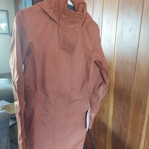 Brand new Athleta trench coat.Size XS,sequoia brown,more coral than brown.